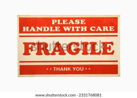 Fragile handle with care sign against white background.