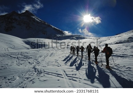 Group of backcountry skiers -ski touring-, west alps, Europe.