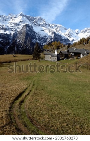 Mountain village during fall season- west Alps, Italy