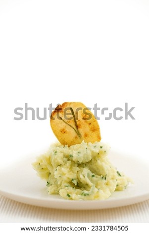 mashed potatoes with chip on plate