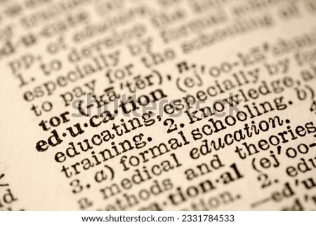 Selective focus of dictionary entry for the word education.