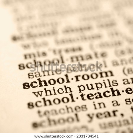 Selective focus of dictionary definition for the word schoolroom.