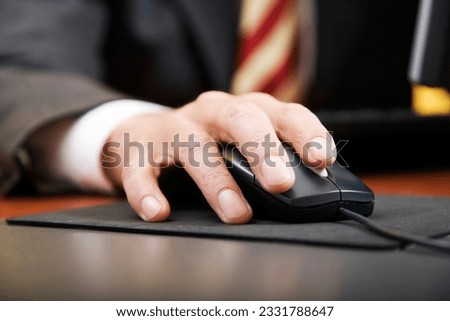people at work- close-up of a businessman-s hand using a mouse