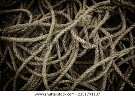 Tangled and twisted fishing rope.