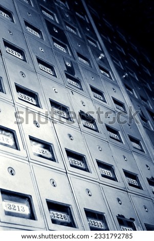 Low angle view of metal mailboxes.