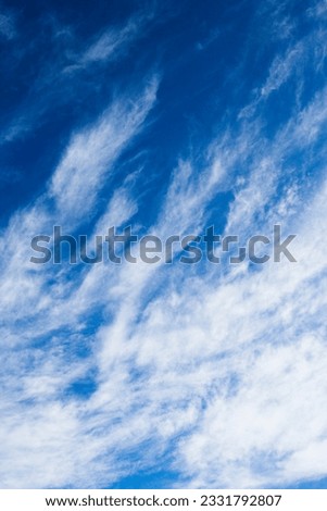 Beautiful blue sky with light wispy clouds.