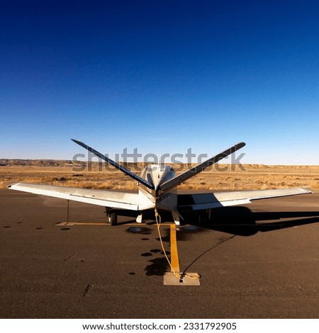 Plane parked on tarmac at Canyonlands Field Airport, Utah, United States.