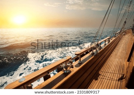 Sailboat in red sea at the sunset