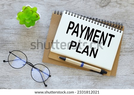 open notebook with text on notepad. payment plan Royalty-Free Stock Photo #2331812021