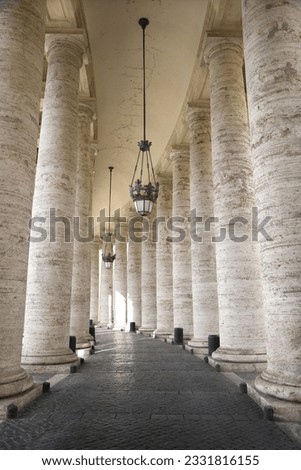 Columned hallway in Saint Peter-s Square. Vertical shot.