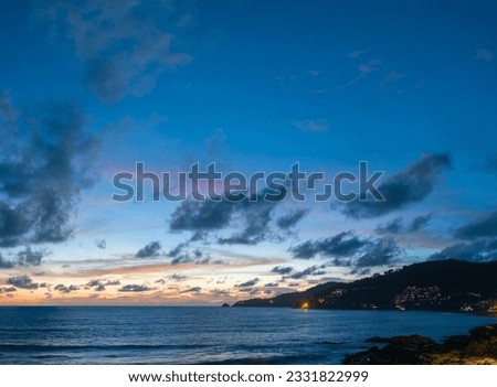 Drones take pictures of the beautiful sky by the beach in stunning sunset.
colorful sky in sunset above Patong city at twilight. 
Scene of romantic sky sunset background.