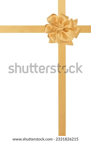 Gold satin ribbon with bow isolated over white background.