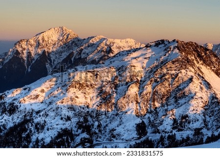 Landscape of snow mountain in sunset with golden color in Taiwan, Asia.