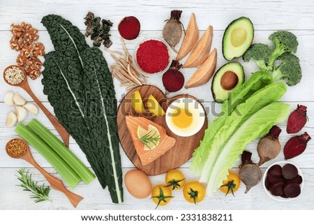 Brain boosting super food with fish, vegetables, seeds, nuts, dairy and herbs. Foods high in omega 3, vitamins, minerals, antioxidants and anthocyanins.