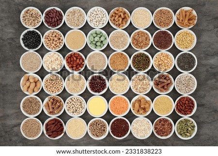 Macrobiotic health food with a large selection of legumes, seeds, nuts, grains, vegetables, cereals and whole wheat pasta with super foods high in protein, omega 3, anthocyanins, antioxidants, mineral