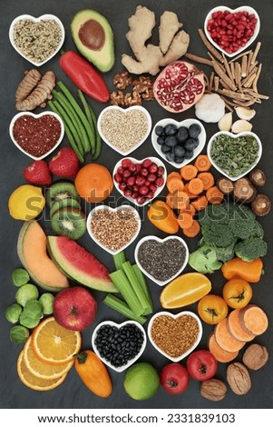 Large super food collection high in antioxidants, vitamins, anthocyanyns, fiber and minerals with fresh fruit, vegetables, seeds, nuts, grains, cereals, pulses, bee pollen grain, herbs and spices.