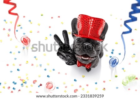 french bulldog dog celebrating new years eve with owner ,isolated on serpentine streamers and confetti , with victory, peace fingers
