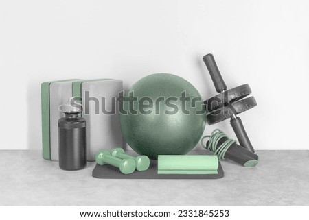 Set of fitness equipment on a gray background, front view, copy space. Home workout. Fitness and activity.  Royalty-Free Stock Photo #2331845253