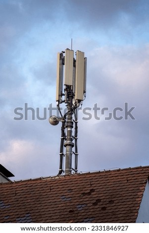A 5G mobile phone antenna on a roof of a private house. The picture was taken in Stuttgart, Germany.