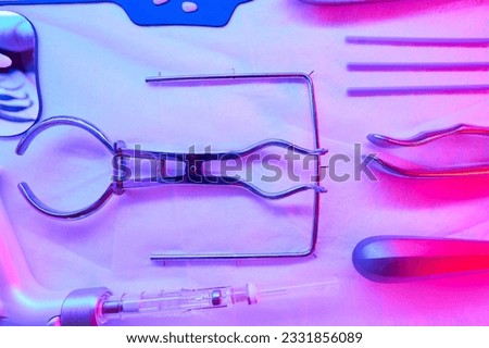 Medical instruments are sterilized under an infrared lamp Royalty-Free Stock Photo #2331856089