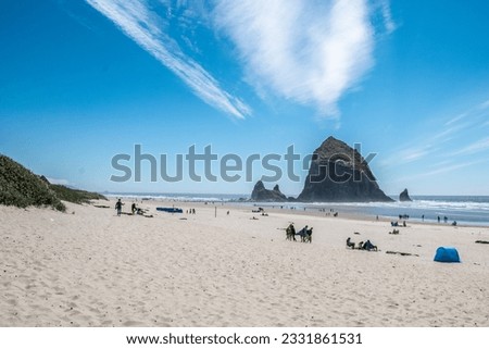 A rare blue sky day at Cannon Beach with Haystack Rock clearly in view. This is one of those pictures that transports me right to that beach where I am leisurely lounging in the sand.