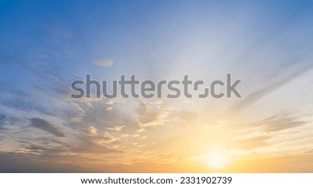 Sunset Sky cloud in the Morning Sunrise with Orange, Yellow Golden Sunrise on summer season, Horizon Sky Background  Royalty-Free Stock Photo #2331902739