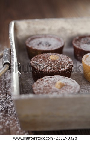 Chocolate  Mini Tartlets in vintage aluminium baking pan, shallow dof