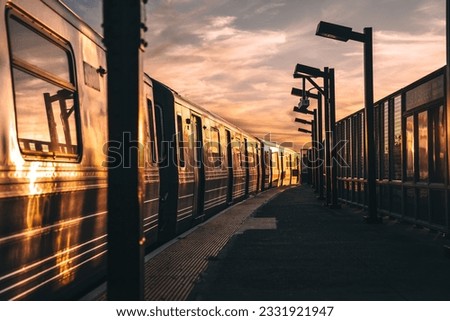 Breathtaking Sunset Train Station - A Captivating Image for Your Story