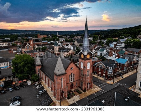 A drone flight through downtown Huntingdon,Pennsylvania on a stormy summer evening.  Royalty-Free Stock Photo #2331961383