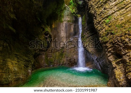 Soca Valley, Slovenia - Kozjak Waterfall (Slap Kozjak) is one of the most beautiful waterfalls in Slovenia in Triglav National Park, Julian Alps, Europe Royalty-Free Stock Photo #2331991987