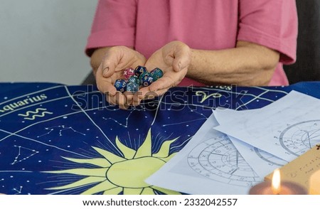 Woman numerologist astrologer counts numbers. Selective focus. People.