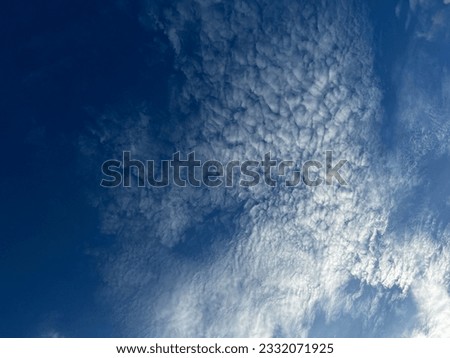blue sky with uniquely shaped clouds