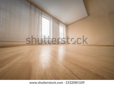 Empty wooden floor closeup and room ceiling and doors with light reflection Royalty-Free Stock Photo #2332085109