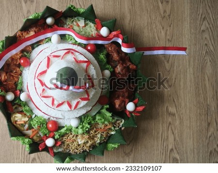 Cone Shaped Rice with Indonesian National Ribbon called Nasi Tumpeng Merah Putih For Independence Day Celebration at 17 August Royalty-Free Stock Photo #2332109107