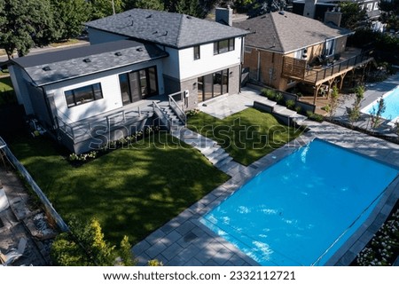 Experience the epitome of luxury living with this stunning house featuring a sparkling swimming pool and beautiful backyard, captured by drone photography. Dive into the ultimate relaxation #pool