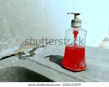 Liquid soap dispenser in the sink