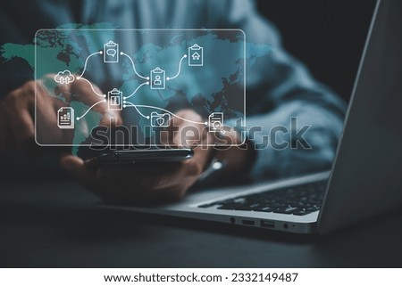 Seamless Document Management, Business professional effortlessly accessing, organizing sharing files on mobile device using digital document management system (DMS). Business technology at its finest. Royalty-Free Stock Photo #2332149487