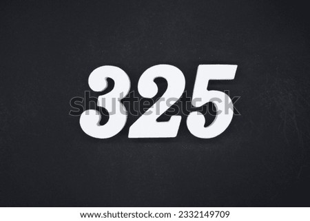 Black for the background. The number 325 is made of white painted wood.