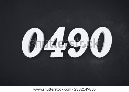 Black for the background. The number 0490 is made of white painted wood.