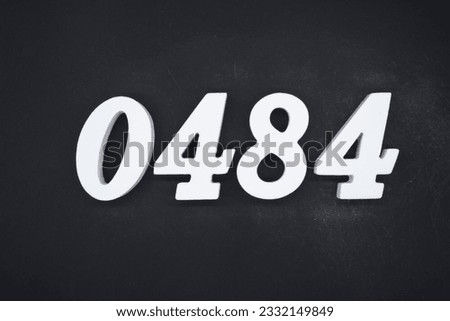 Black for the background. The number 0484 is made of white painted wood.