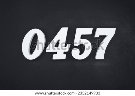 Black for the background. The number 0457 is made of white painted wood.