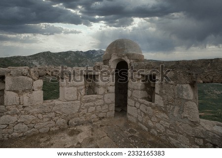 Klis fortress in croatia watchtower shelter at cloudy sky