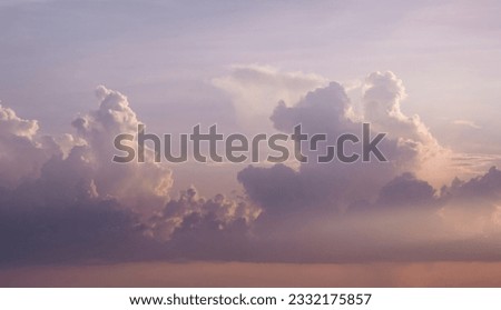 Cumulonimbus clouds at dusk golden sunset Royalty-Free Stock Photo #2332175857