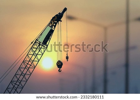 the hook block of the mobile crane and slinging that inspector inspected before starting work, the main construction built is heavy equipment. Royalty-Free Stock Photo #2332180111
