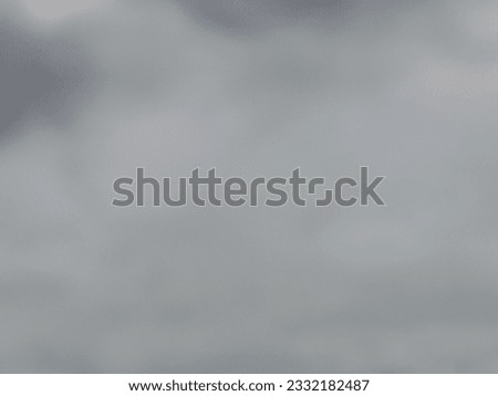 A photograph of a gray wall with white streaks on one side bright on the other side, used as a background and abstract illustration.