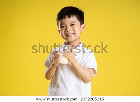 image of asian boy posing on a yellow background
 Royalty-Free Stock Photo #2332205215