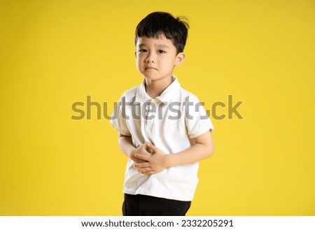 image of asian boy posing on a yellow background
 Royalty-Free Stock Photo #2332205291