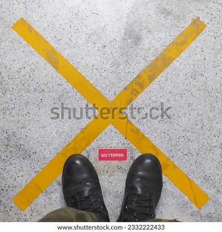 birdseye-view for concrete floor and text "waiting area" in Thai word.