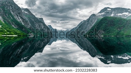 Water reflection in a fjord lake in Norway Royalty-Free Stock Photo #2332228383