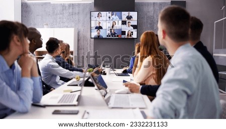 Online Video Conference Call In Boardroom Meeting Royalty-Free Stock Photo #2332231133